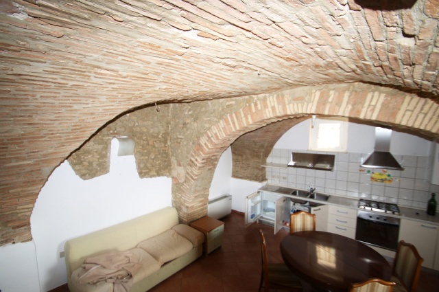 Vaulted ceilings and exposed brick walls