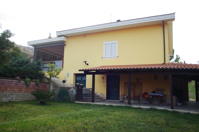 Garden and porch of detached house in the countryside near Atri