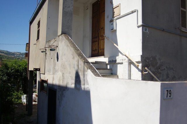 Facade and entrance of house to be renovated in Borgo Santa Maria Pineto